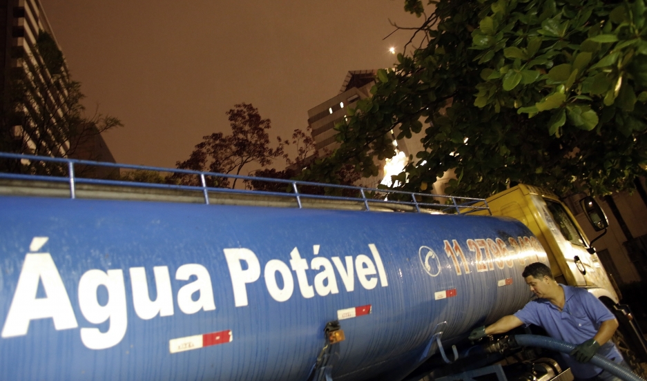 A worker fills a water tanker for distribution to a hospital in São Paulo in February. Residents throughout the metropolitan region of 20 million people are taking emergency measures amid a severe drought.